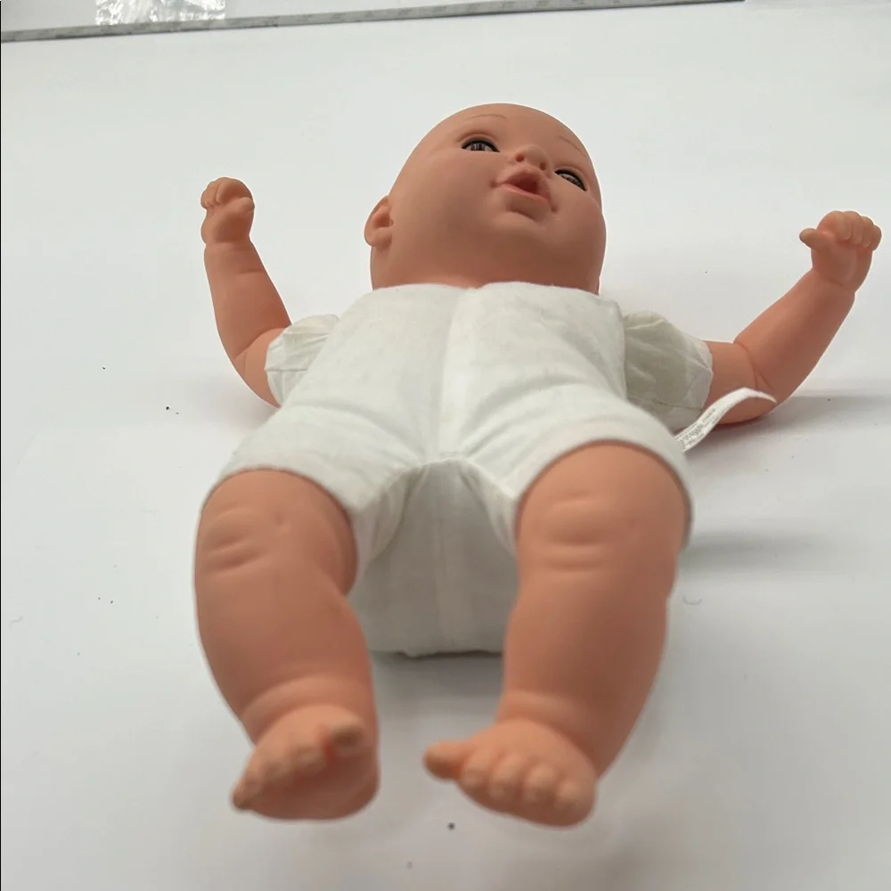 Realistic Baby Doll with White Outfit